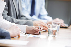 Close up of hands of business people during a meeting